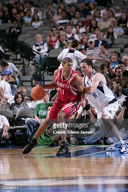 Shane Battier of the Houston Rockets is defended by Austin Croshere of the Dallas Mavericks during the preseason game on October 17, 2006 at the...