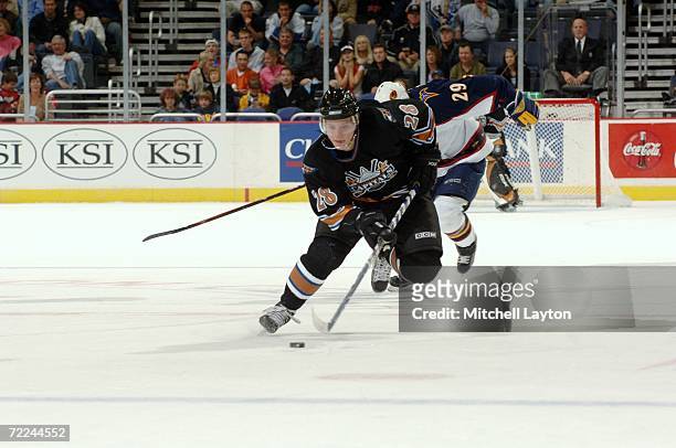 Alexander Semin of the Washington Capitals skates with the puck against the Atlanta Thrashers at the Verizon Center on October 14, 2006 in...