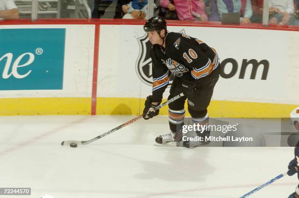 Matt Bradley of the Washington Capitals skates with the puck against the Atlanta Thrashers at the Verizon Center on October 14, 2006 in Washington,...