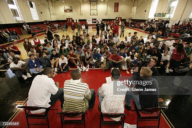 Maurice Ager, Jason Terry, Devin Harris and Mark Followill of the Dallas Mavericks listen to questions from the crowd at Hillcrest High School during...