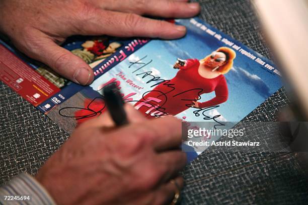 John Waters signs a "Pink Flamingos" DVD at a book signing for "Tennessee Willams Memoirs," for which Waters wrote the introduction, at the Drama...