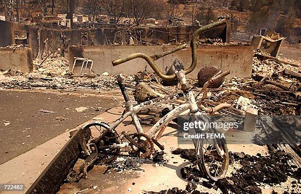 Ruins of destroyed homes in a trailer park caught in the path of the Hayman wildfire burning in the Rocky Mountains southwest of Denver, Colorado are...