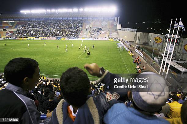 Young Beitar Jerusalem fans watch their team's 3-0 victory over Maccabi Herzliya on Sunday evening October 22, 2006 at their home ground of Teddy...