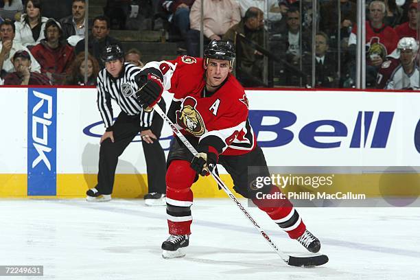 Wade Redden of the Ottawa Senators fires a cross ice pass to his left during a power play in a game against the Colorado Avalanche on October 19,...