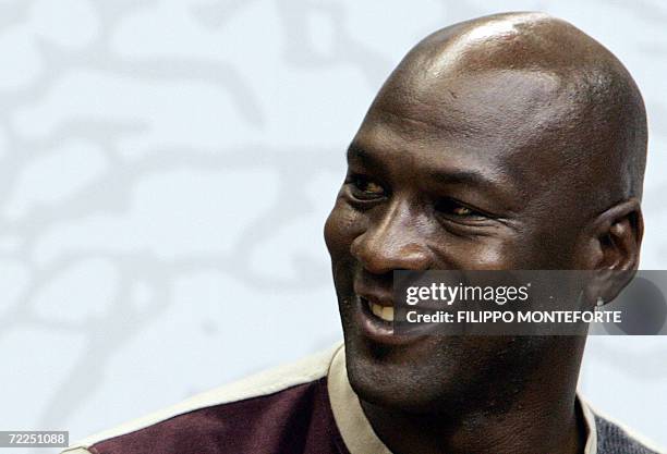 Former NBA Chicago Bulls basketball player Michael Jordan speaks to young basketball players as he is in Milan to promote a new clothing line, 24...