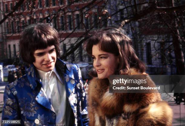 Guitarist Peter Frampton of English pop group, The Herd, with actress Romy Schneider on the set of 'Otley', directed by Dick Clement, London, 1968.