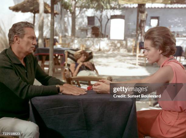 Peter Finch and Romy Schneider on the set of '10:30 P.M. Summer', directed by Jules Dassin, 1965. In the background is Melina Mercouri .