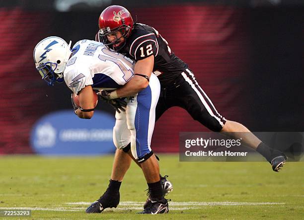 Brett Sturm of the San Diego State Aztecs tackles Justin Handley of the Air Force Falcons on October 21, 2006 at Qualcomm Stadium in San Diego,...