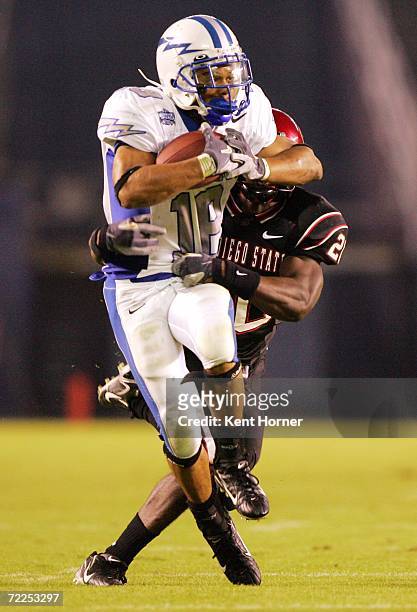 Justin Handley of the Air Force Falcons runs with the ball against Ray Bass of the San Diego State Aztecs on October 21, 2006 during their game at...