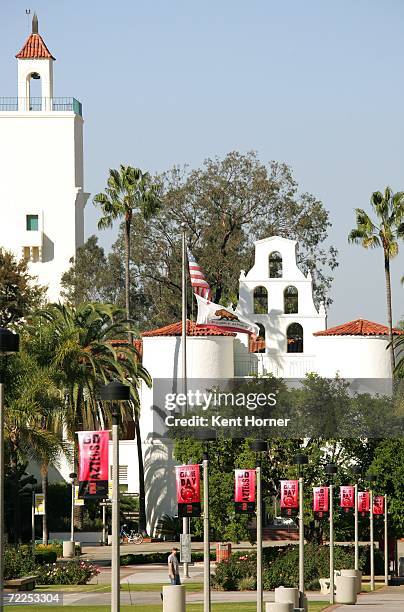 Banners supporting the San Diego State Aztecs hang from light poles lining the walkway in front of Hepner Hall on the SDSU campus before the game...