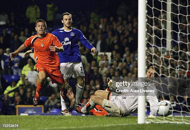 Keith Keane of Luton Town steers the ball past Marlon Beresford for an own goal during the Carling Cup third round match between Everton and Luton...