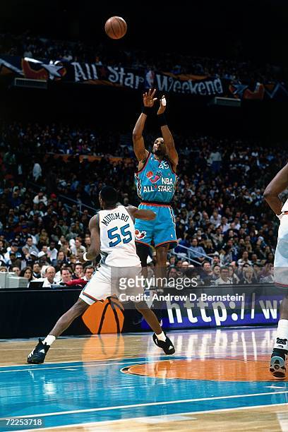 Alonzo Mourning of the Eastern Conference All-Stars attempts a shot against Dikembe Mutombo of the Western Conference All-Stars during the 1996 NBA...