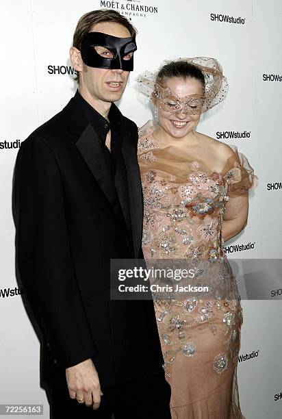 Photographer Nick Knight and guest arrive at the Moet & Chandon Fashion Tribute to Knight on October 24, 2006 in London, England.