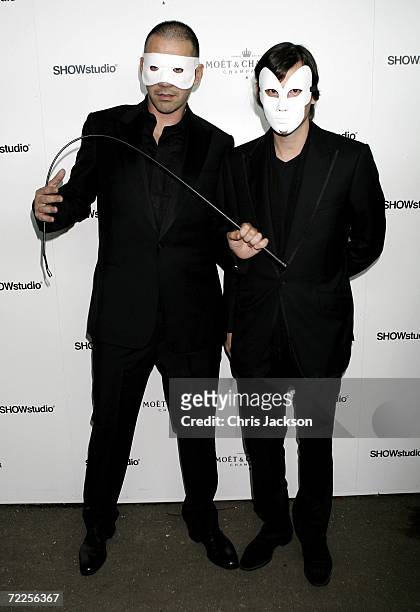 Designer Roland Mouret and guest arrive at the Moet & Chandon Fashion Tribute to photographer Nick Knight on October 24, 2006 in London, England.
