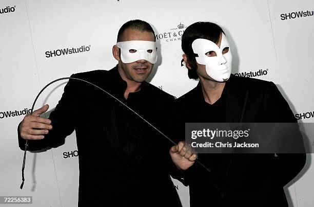 Designer Roland Mouret and guest arrive at the Moet & Chandon Fashion Tribute to photographer Nick Knight on October 24, 2006 in London, England.