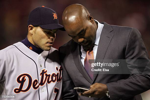 Ivan Rodriguez of the Detroit Tigers talks with Carlos Delgado of the New York Mets before Game Three of 2006 World Series against the St. Louis...