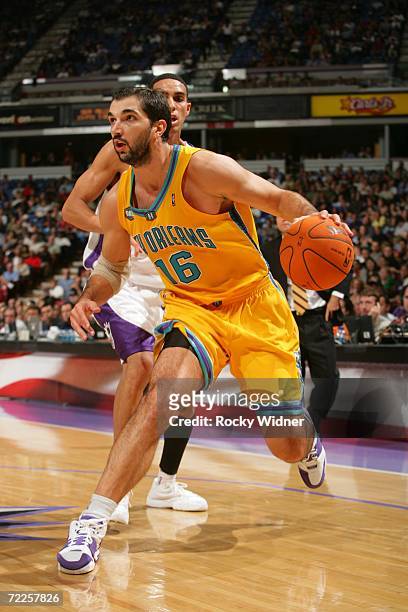 Peja Stojakovic of the New Orleans/Oklahoma City Hornets gets past Kevin Martin of the Sacramento Kings on October 24, 2006 at ARCO Arena in...