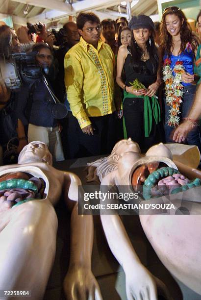 Miss Universe 2006 Puerto Rican Zuleyka Rivera and Indian designer Sanjana Jon look at exhibits at The Antaran Sexully Transmitted Disease Clinic in...