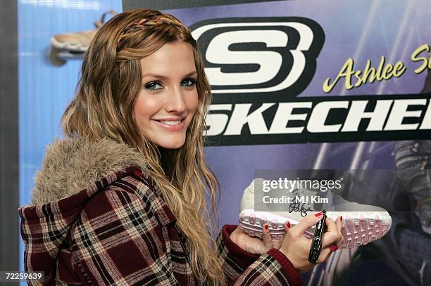 American singer Ashlee Simpson poses for photographers to celebrate the launch of her Skechers Campaign at Skechers Oxford Street store on October...