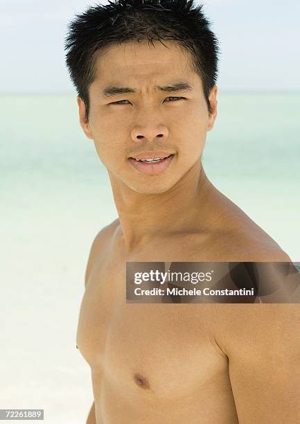 barechested man, sea in background - knitting brow stock pictures, royalty-free photos & images