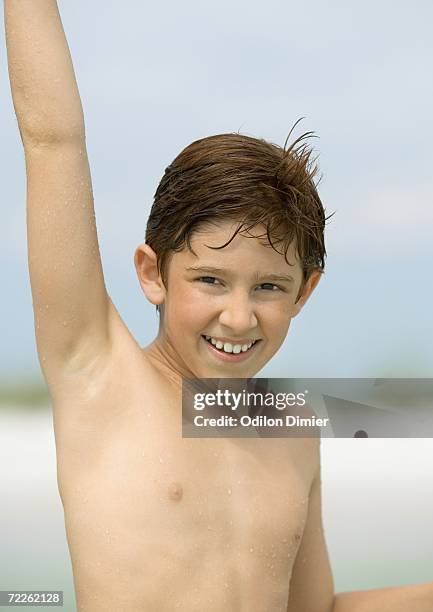 boy with arm raised, portrait - boy armpit stock-fotos und bilder