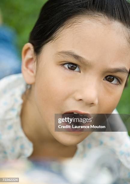 girl making annoyed face - knitting brow stock pictures, royalty-free photos & images