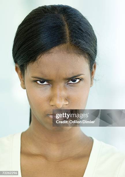 teen girl frowning, portrait - knitting brow stock pictures, royalty-free photos & images