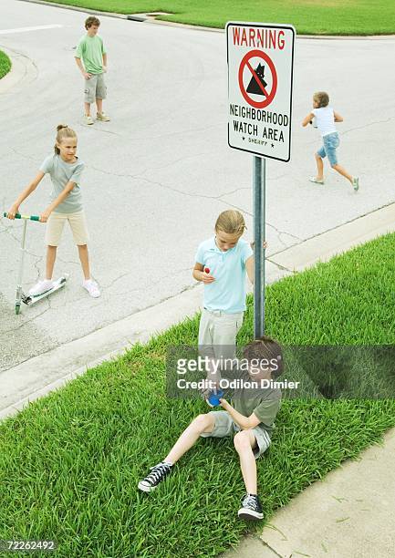 suburban children hanging out in street - 地域防犯監視 ストックフォトと画像
