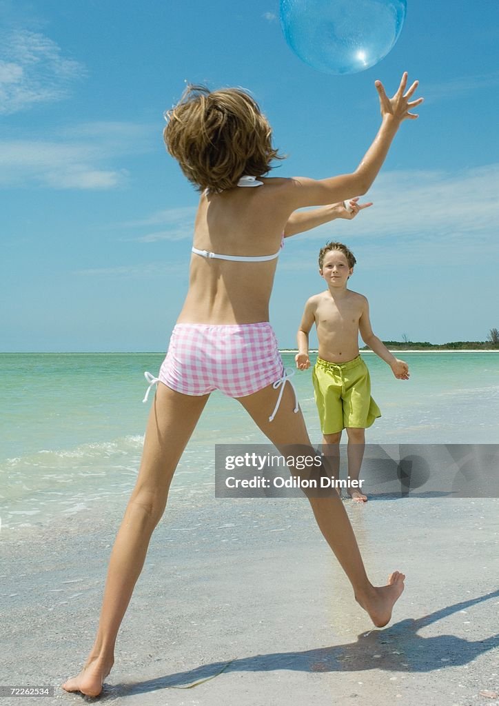 Children playing ball on the beach