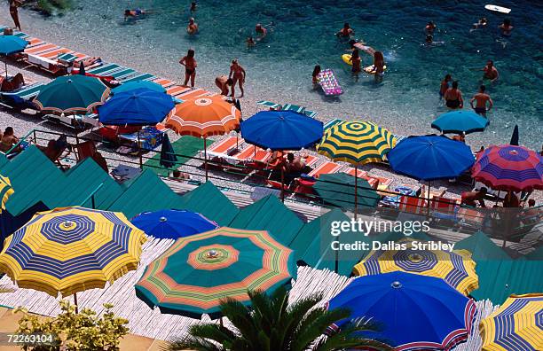 overhead of umbrellas at private bathing area of marine piccola beach, capri, italy - italian summer ストックフォトと画像