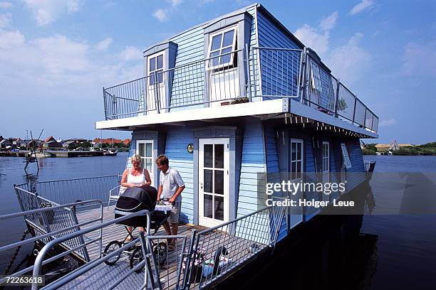 houseboat in hvide sande, ringkobing fjord, hvide sande, denmark - hvide sande denmark stock pictures, royalty-free photos & images