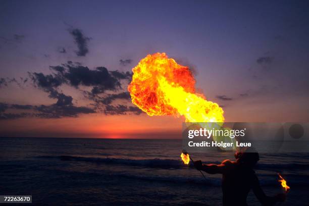 fireeater at sunset, jamaica - one person in focus stock pictures, royalty-free photos & images