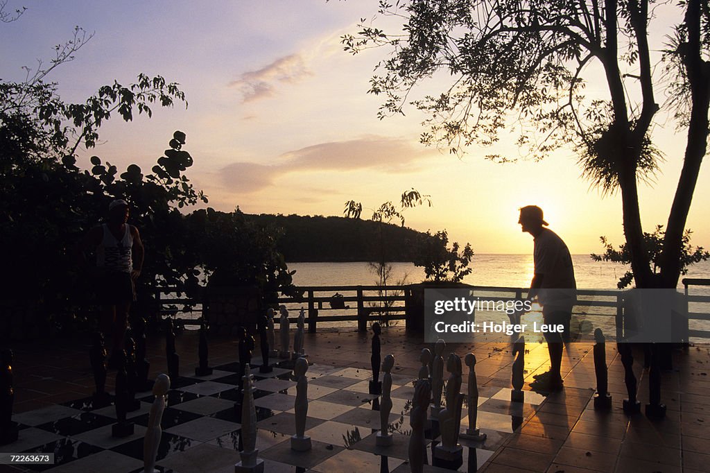 Playing Floor Chess at Sunset at Grand Lido Sans Souci Resort, Ocho Rios, Jamaica