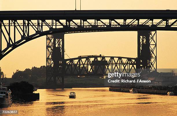 bridges over cuyahoga river at dusk, cleveland, united states of america - cuyahoga river stock pictures, royalty-free photos & images