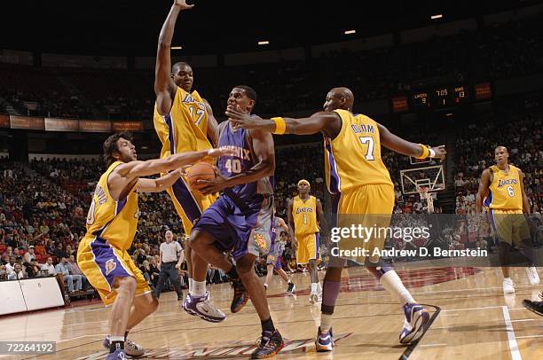 Kurt Thomas of the Phoenix Suns drives to the basket between Vladimir Radmanovic, Andrew Bynum and Lamar Odom of the Los Angeles Lakers during a...