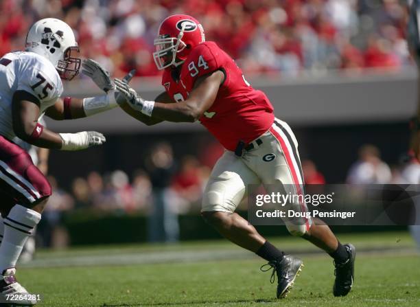 Quentin Moses of the Georgia Bulldogs moves to block Craig Jenkins of the Mississippi State Bulldogs during SEC college football action on October...