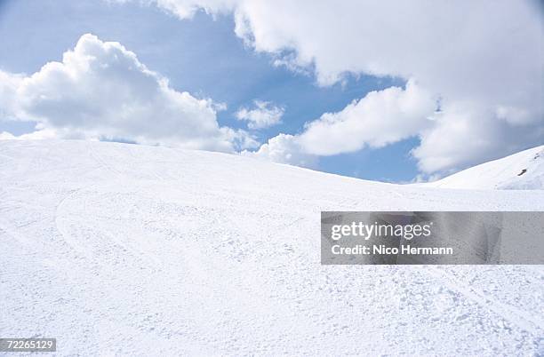 snowy hills under cloudy sky - snow hill stock pictures, royalty-free photos & images