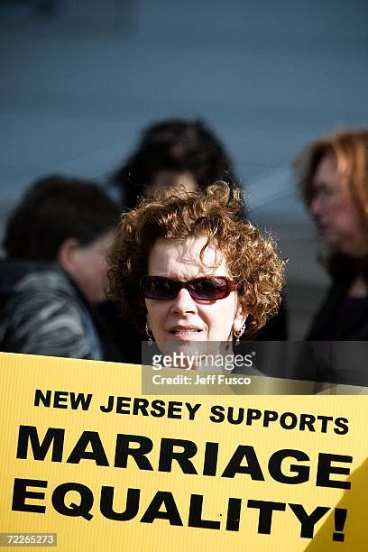 Supporters await the New Jersey Supreme court decision on same-sex marriage in front of the Supreme court building on October 25, 2006 in Trenton,...