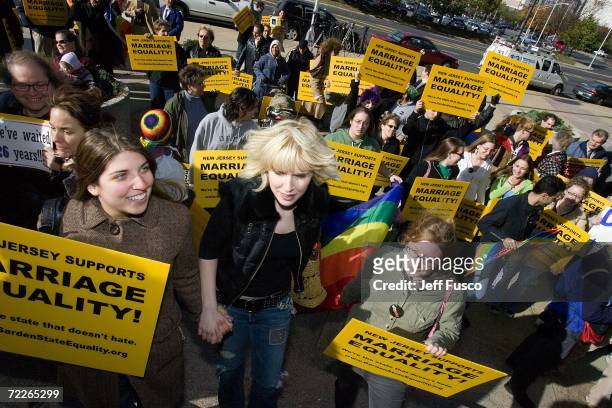 Supporters await the New Jersey Supreme court decision on same-sex marriage in front of the Supreme court building on October 25, 2006 in Trenton,...