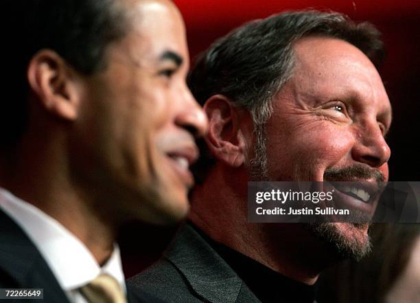 Oracle CEO Larry Ellison watches a demonstration with Oracle president Charles Phillips during a keynote address at the 2006 Oracle OpenWorld...