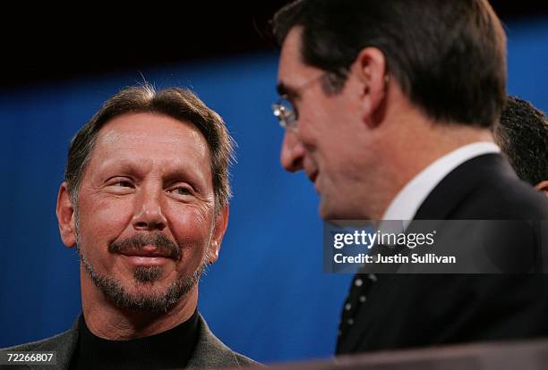 Oracle CEO Larry Ellison speaks with Nasdaq CEO Robert Greifeld before closing the Nasdaq market at the 2006 Oracle OpenWorld conference October 25,...