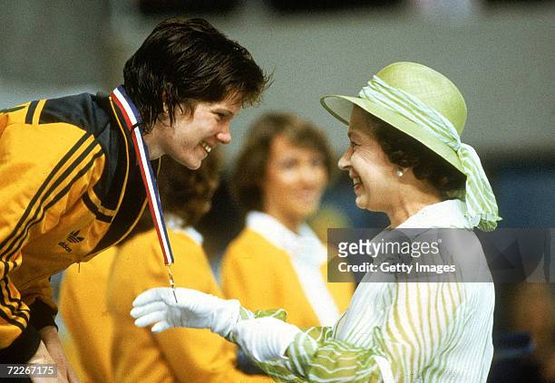 Tracey Wickham of Australia recieves her gold medal from Queen Elisabeth during the 1982 Commonwealth Games held in Brisbane, Australia.