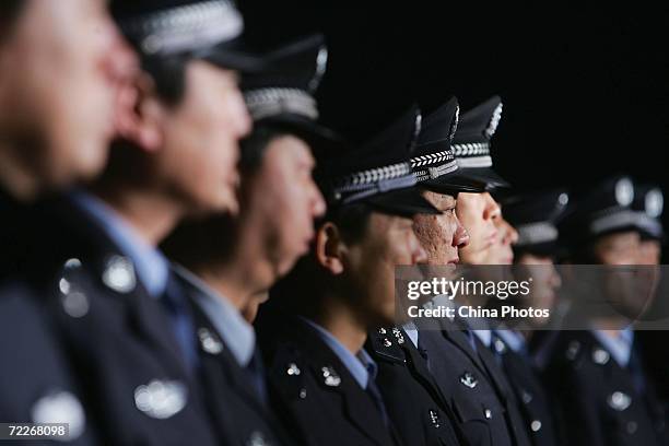 Policemen take part in a raid on entertainment venues on October 25, 2006 in Beijing, China. The raid is part of Beijing police's efforts to...