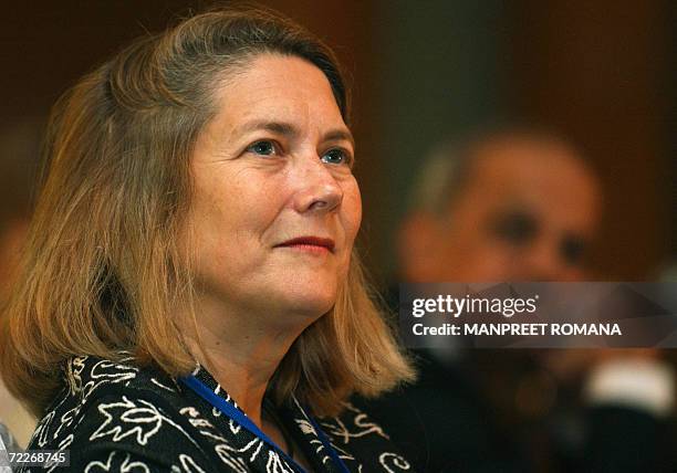 Linux Program Director for Worldwide Public Sector Mary Ann Fisher listens to the speakers during the start of a conference on 'South Asia...