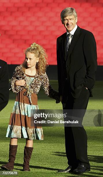 Arsenal Manager Arsene Wenger looks on with his 9 year old daughter Lea at the official opening of Arsenal Emirates Stadium on October 26, 2006 in...