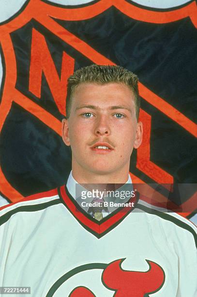Canadian hockey player Martin Brodeur poses in the uniform of the New Jersey Devils after he became their first round selection in the NHL Entry...