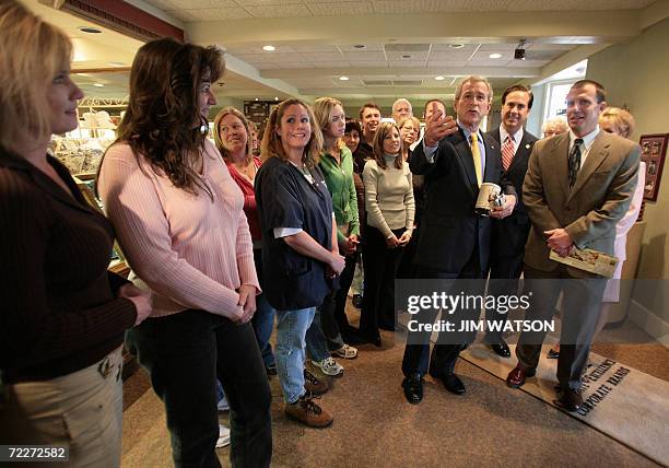 Clinton Township, UNITED STATES: US President George W. Bush speaks to the press after touring Morely Candy Makers with President Roy Rapson and...