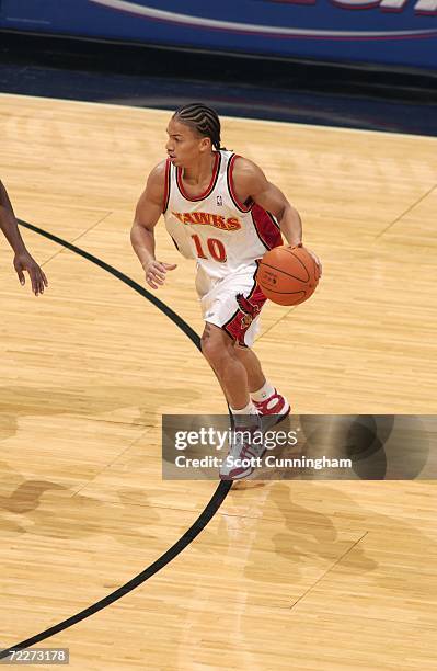 Tyronn Lue of the Atlanta Hawks drives during a preseason game against the Washington Wizards at Philips Arena on October 23, 2006 in Atlanta,...