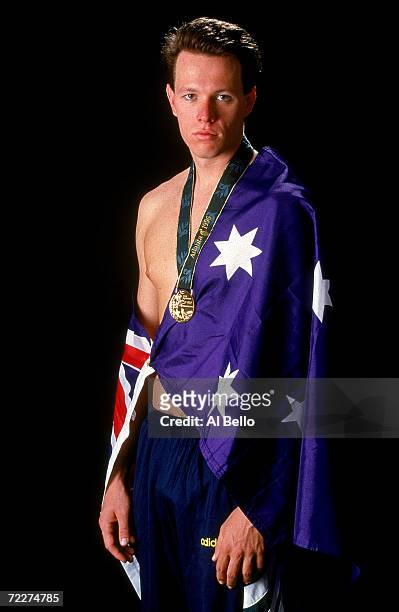 Olympic gold medalist Kieren Perkins of Australia poses with his medal and a Australian flag during the 1996 Olympic Games held in Atlanta, USA....