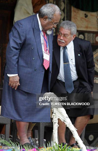 Papua New Guinean Prime Minister Michael Somare talks to Fijian Prime Minister Laisenia Qarase during the opening ceremony for the 37th Pacific...